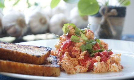 Scrambled eggs with tomato and basil